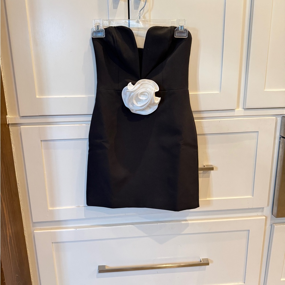 Elegant Black Strapless Dress with White Floral Accent